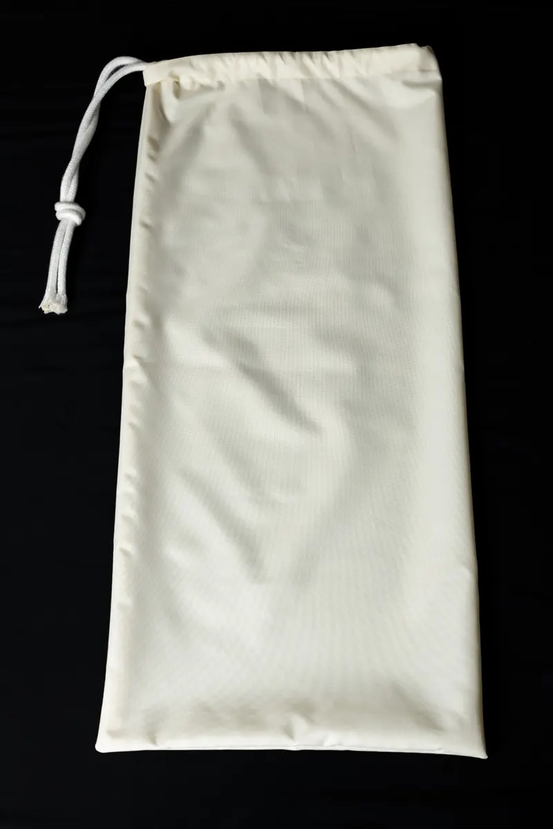 White drawstring bag for the leg
