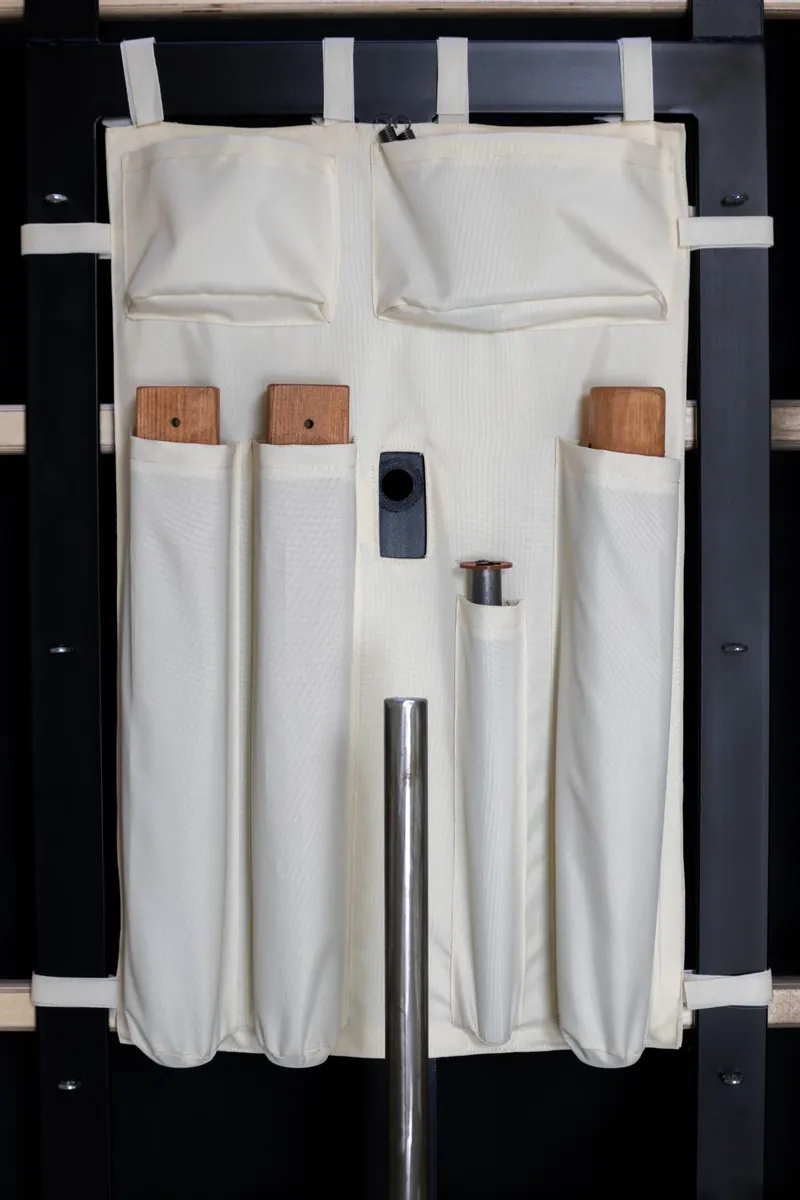 Parts pouch with stored arms and locking bar